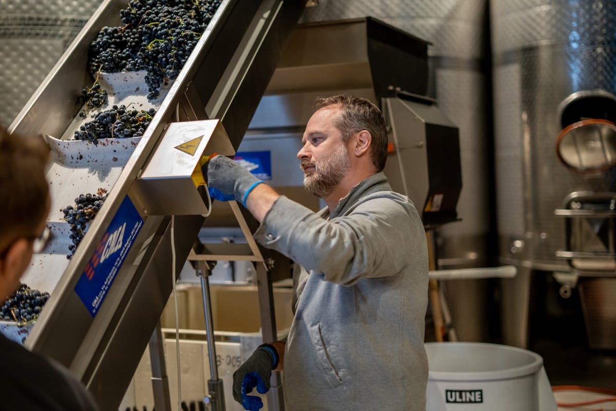 a man standing in front of a computer